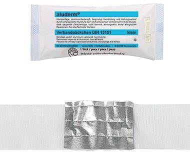 Verband aluderm® 6 cm x 3 m (B x L) Maße Kompresse: 8 x 6 cm (B x L) Polyestervlies aluminiumbedampft ALUDERM